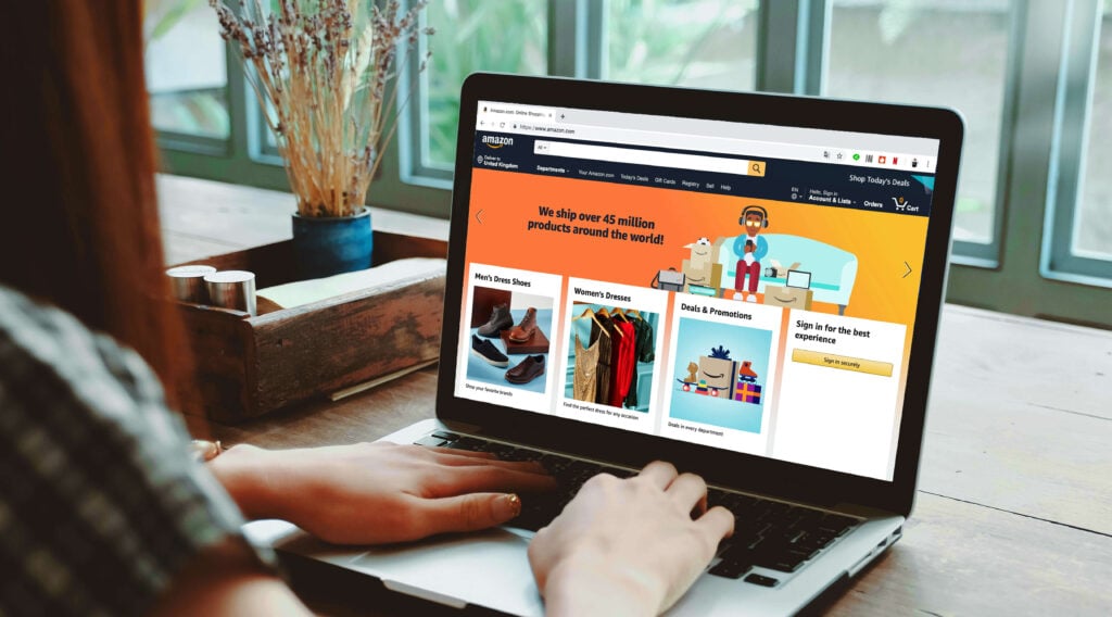 Person shopping on a laptop and viewing the Amazon homepage