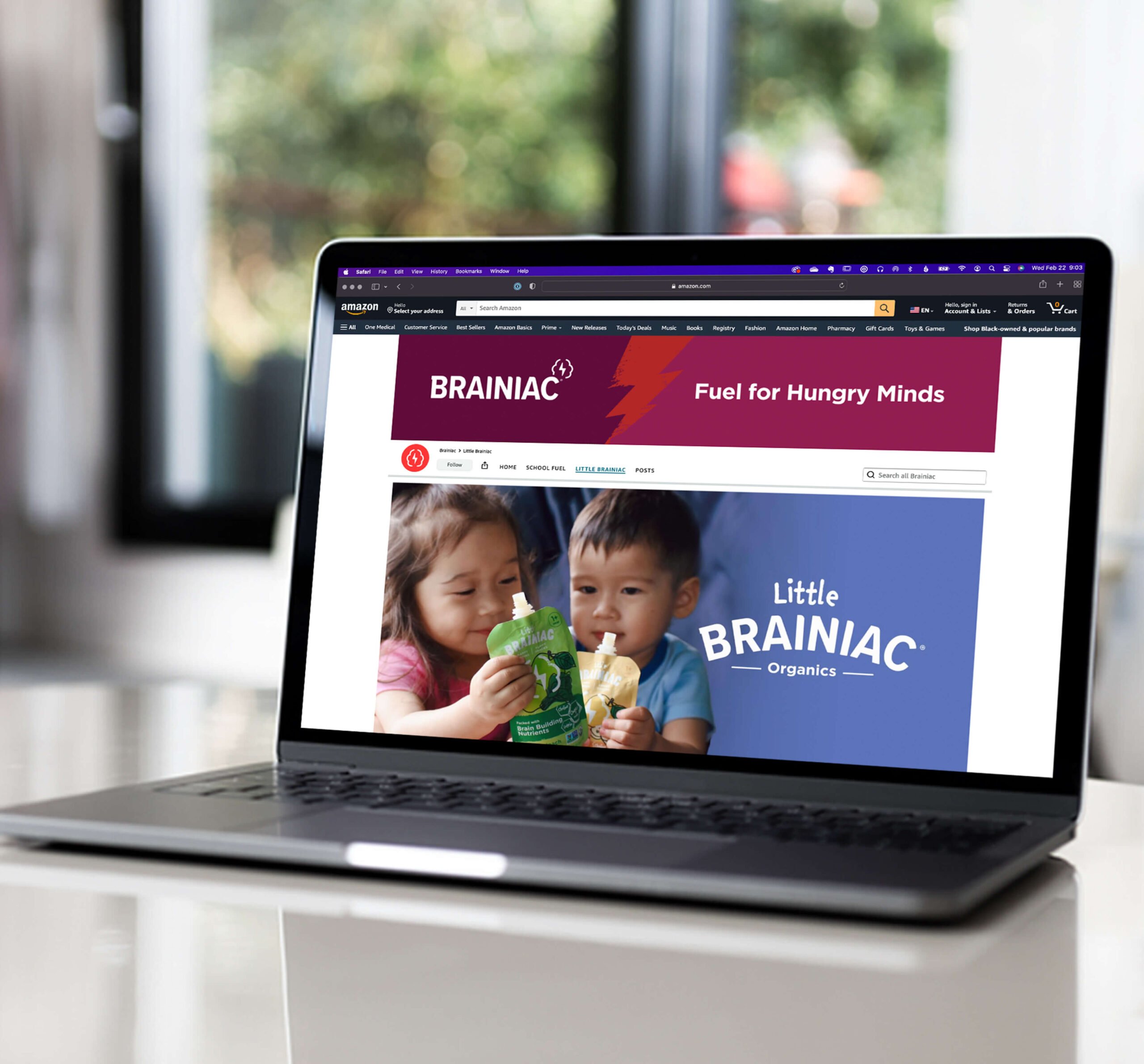 The Little Brainiac brand store tab in Amazon, displayed on a laptop