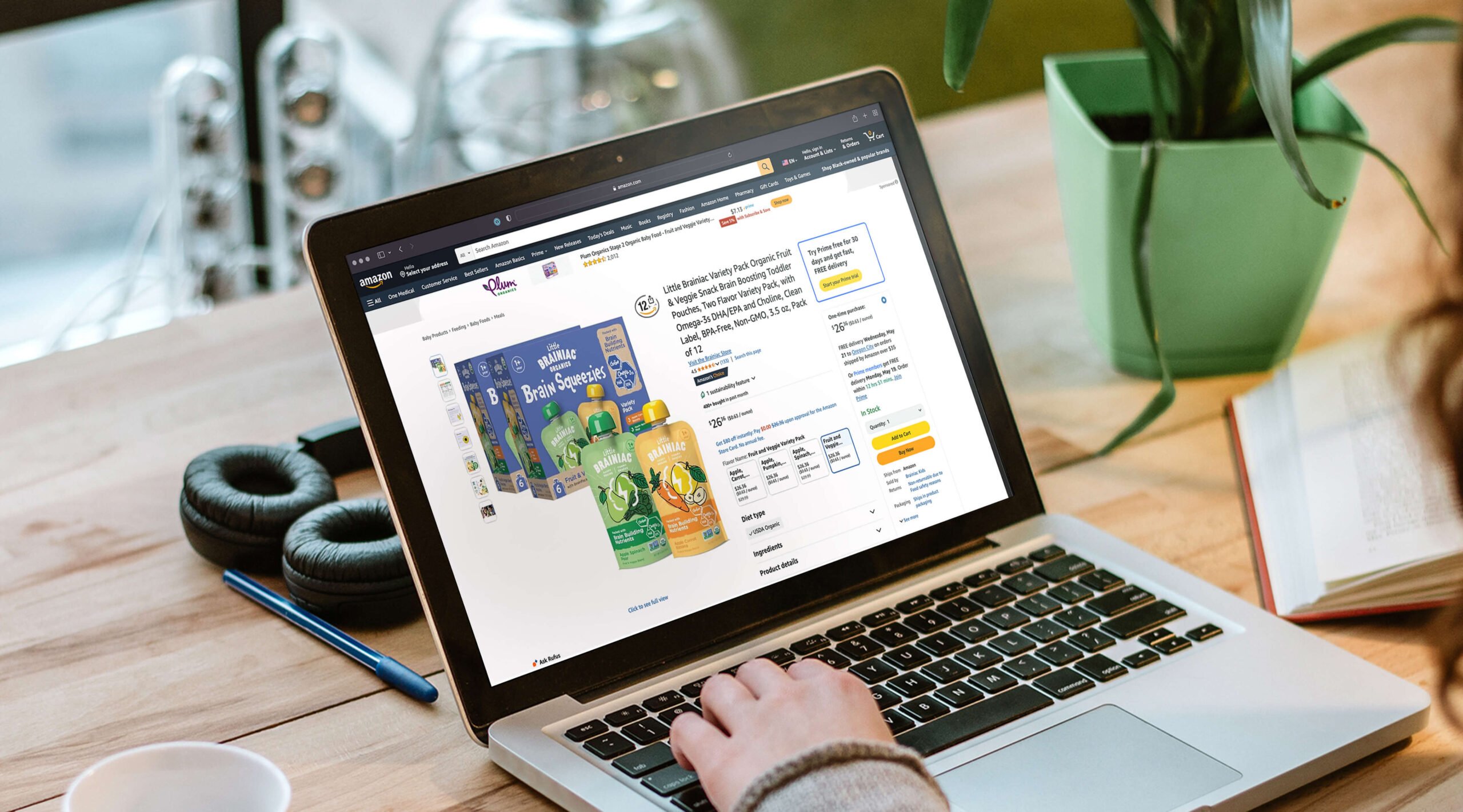 Person shopping on a laptop viewing the Little Brainiacs product page on Amazon